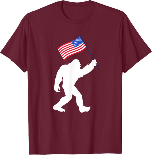 Bigfoot With American Flag Funny 4th Of July T-Shirt - T-Shirt | Maroon
