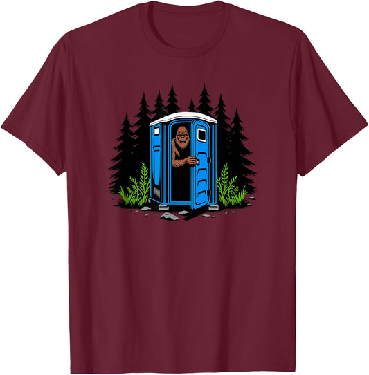 Bigfoot Peeking Out of A Porta Potty in The Woods T-Shirt - T-Shirt | Maroon