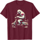 Bigfoot Driving Scooter - Funny Sasquatch Yeti Roller T-Shirt - T-Shirt | Maroon