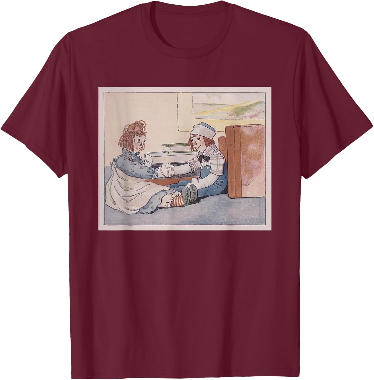 Raggedy Ann & Andy - Their Hands Tied Together Near Books T-Shirt - T-Shirt | Maroon