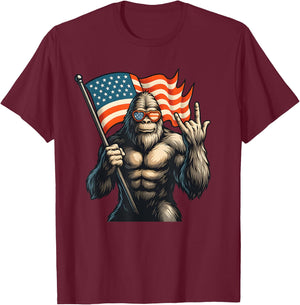 Patriotic Bigfoot Holding USA Flag Rock Hand Sunglasses T-Shirt - T-Shirt | Maroon