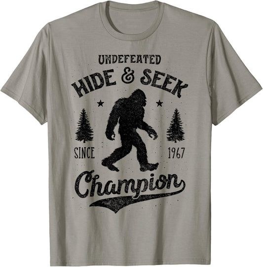 Bigfoot Hide And Seek Champion Funny Sasquatch Retro Vintage T-Shirt - T-Shirt | Sand