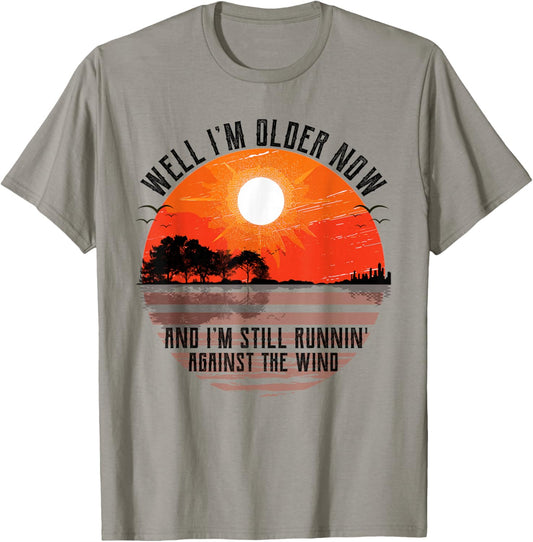 Well Im Older Now But Im Still Running Against The Wind T-Shirt - T-Shirt | Sand