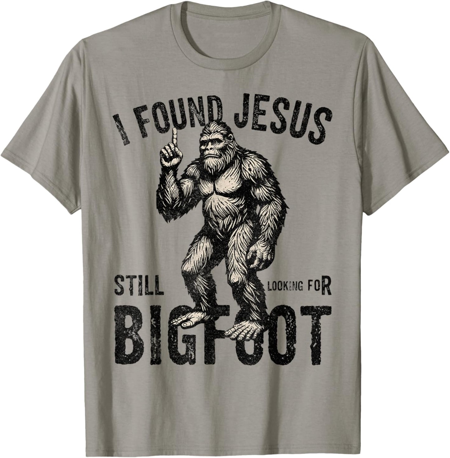 I Found Jesus Still Looking for Bigfoot Funny Christian T-Shirt - T-Shirt | Sand